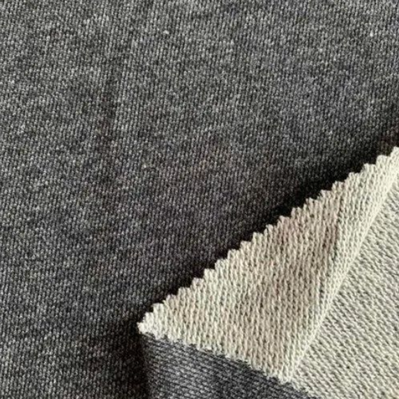 Grey French terry cotton loopknit fabric with cream reverse side